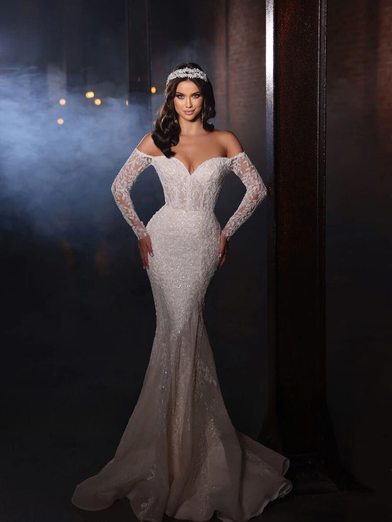 Luxurious off-shoulder mermaid bridal gown with beading and lace appliques, available in white and champagne.