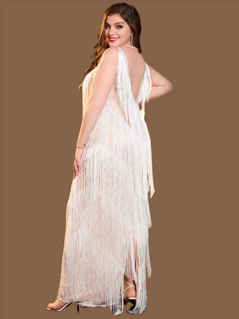 White plus size sequin mini dress with a V-neckline, fringe details, sleeveless design, and back zipper closure.