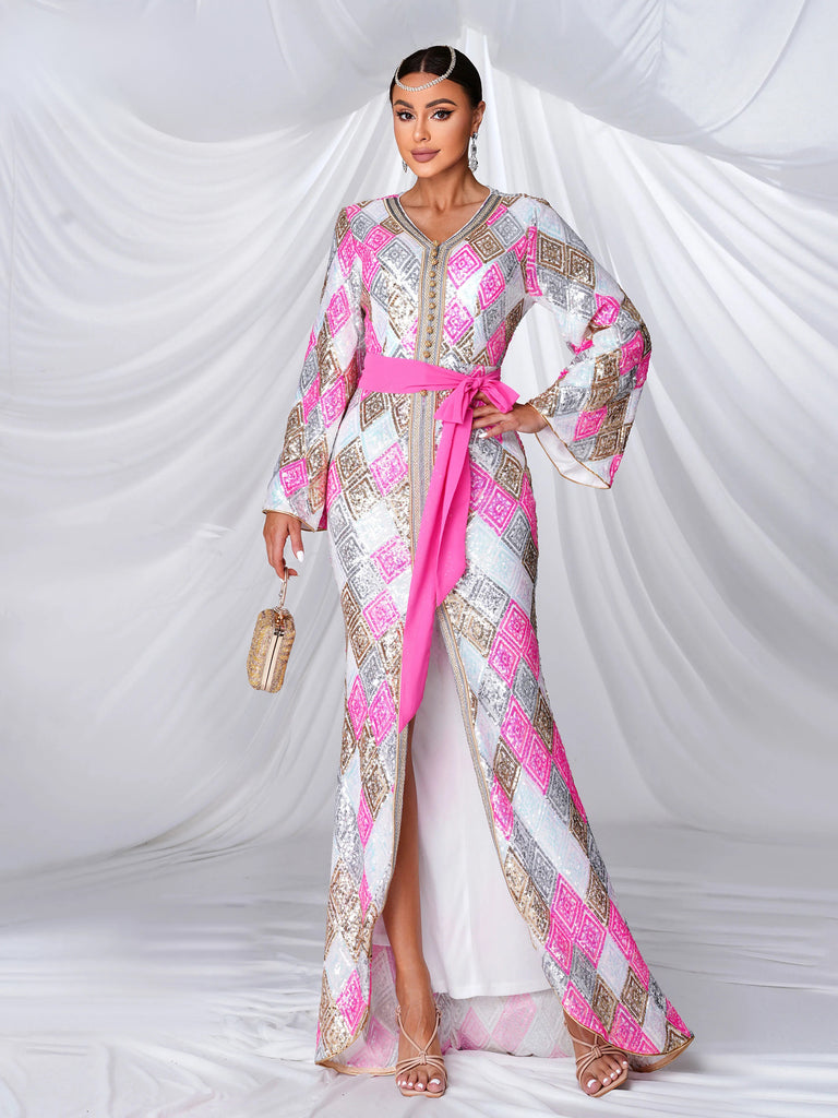 kaftan-style gown adorned with pink and gold geometric patterns, featuring wide bell sleeves, a front slit, and a bold pink sash accentuating the waist for a sophisticated and luxurious look.