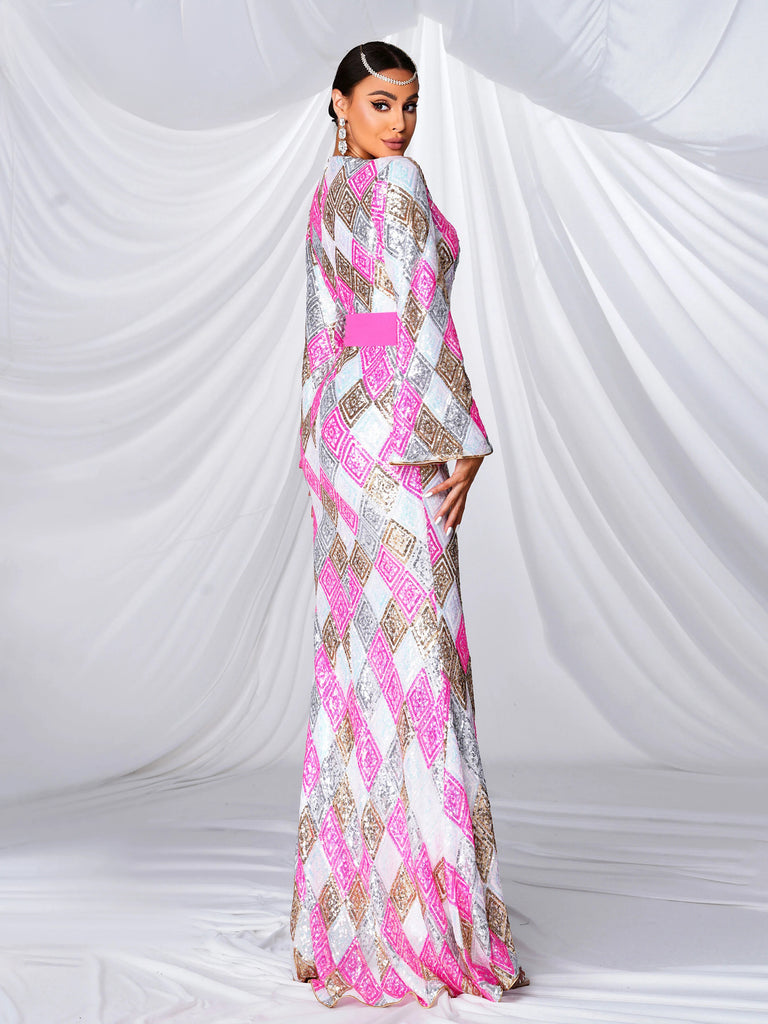 kaftan-style gown adorned with pink and gold geometric patterns, featuring wide bell sleeves, a front slit, and a bold pink sash accentuating the waist for a sophisticated and luxurious look.