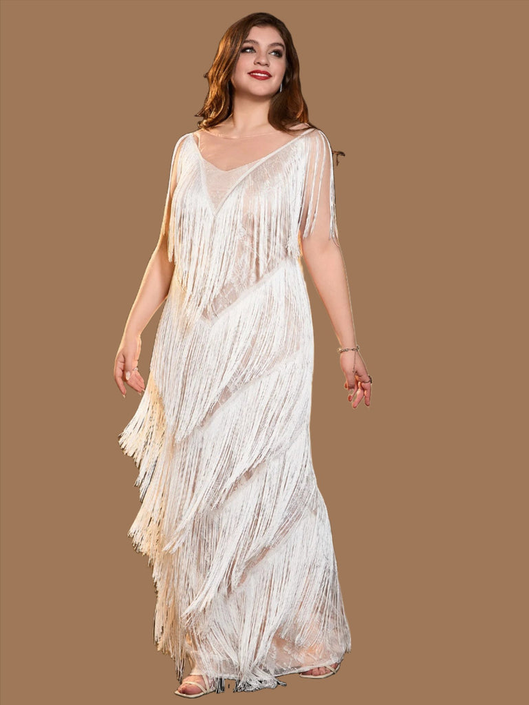 White plus size sequin mini dress with a V-neckline, fringe details, sleeveless design, and back zipper closure.