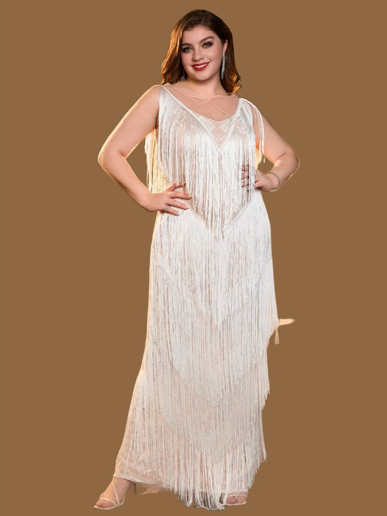 White plus size sequin mini dress with a V-neckline, fringe details, sleeveless design, and back zipper closure.