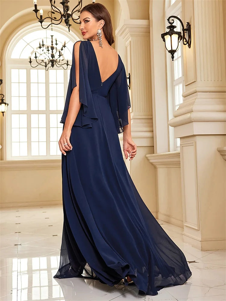 Chiffon long sleeve evening dress with a high slit, available in navy and royal blue.