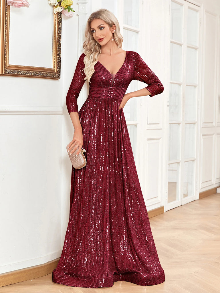 An elegant burgundy sequin gown with a deep V-neckline, 3/4 sleeves, and a flowing A-line silhouette is perfect for evening galas or formal occasions.