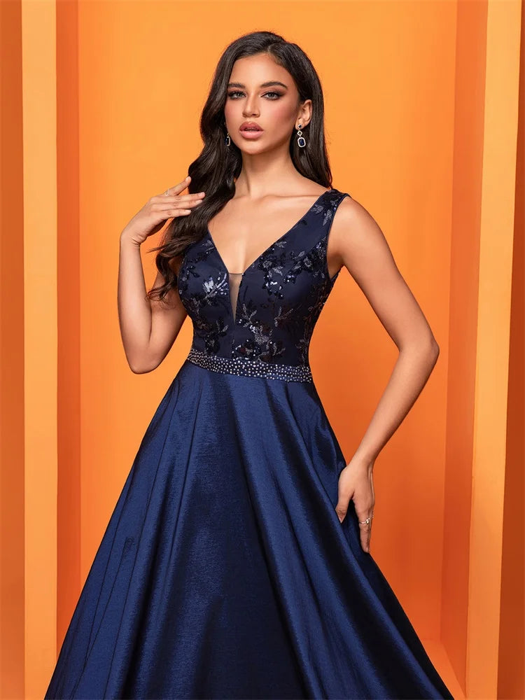 Elegant navy blue satin evening dress with sequins and a deep V-neck, perfect for formal occasions.