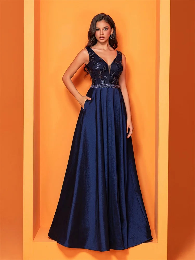 Elegant navy blue satin evening dress with sequins and a deep V-neck, perfect for formal occasions.