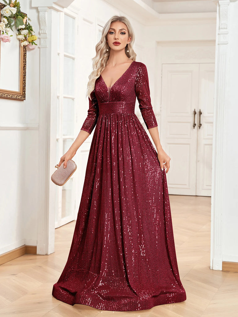 An elegant burgundy sequin gown with a deep V-neckline, 3/4 sleeves, and a flowing A-line silhouette is perfect for evening galas or formal occasions.