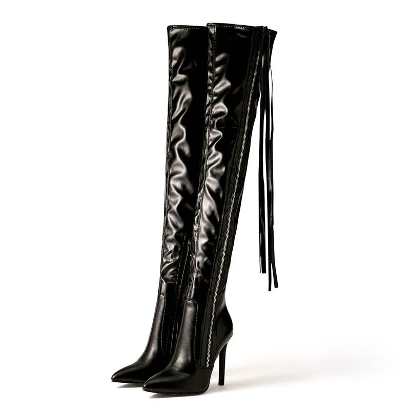 Black over-the-knee boots with pointed toes, high heels, and fringe details for a bold and fashionable winter style.