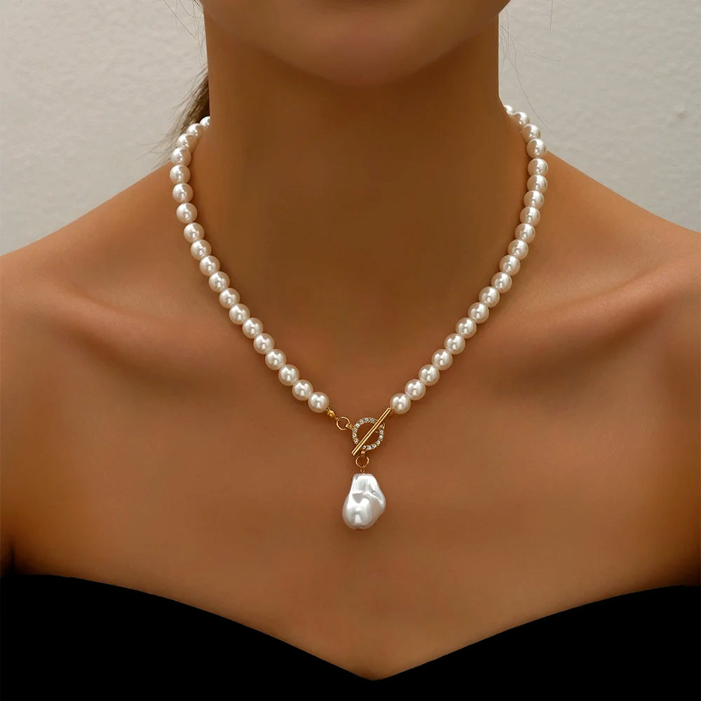 Adjustable pearl choker necklace featuring a string of elegant pearls and Crystal Pendant, offering a customizable fit for a timeless and sophisticated look.