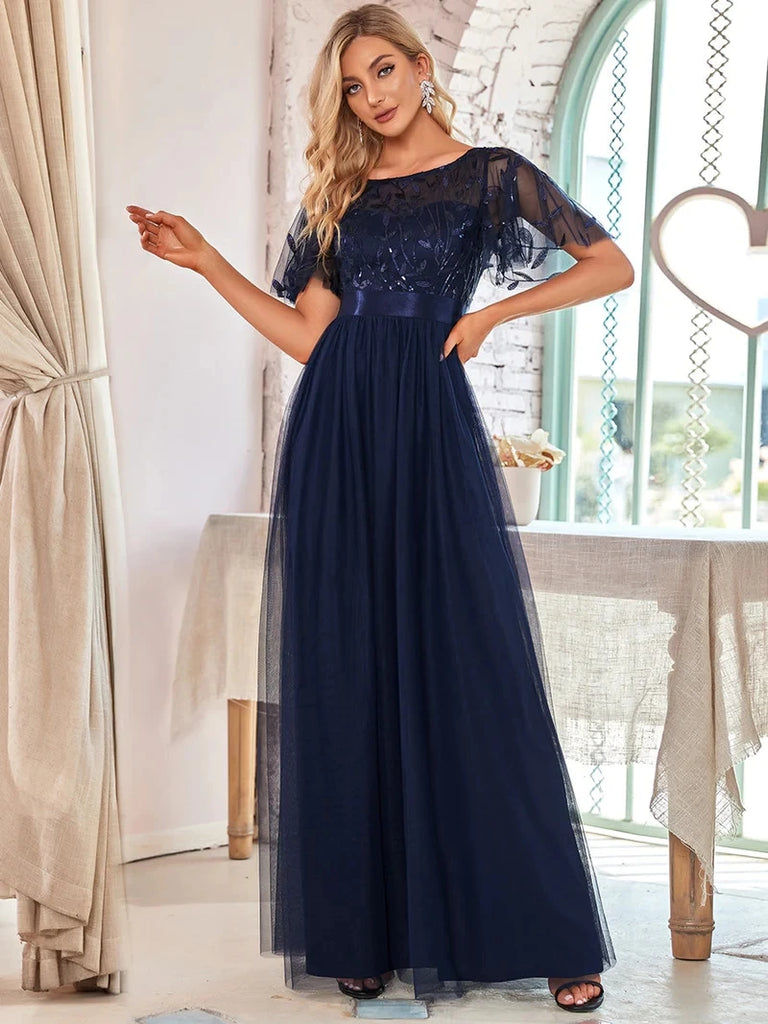 A-line evening dress with cap sleeves and sequins, available in a range of elegant colors, perfect for formal events.