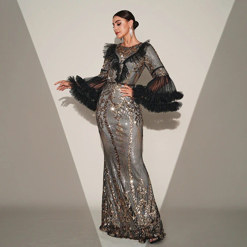 Elegant black maxi dress with sequins, flare sleeves, and a sheer mesh design for formal occasions.