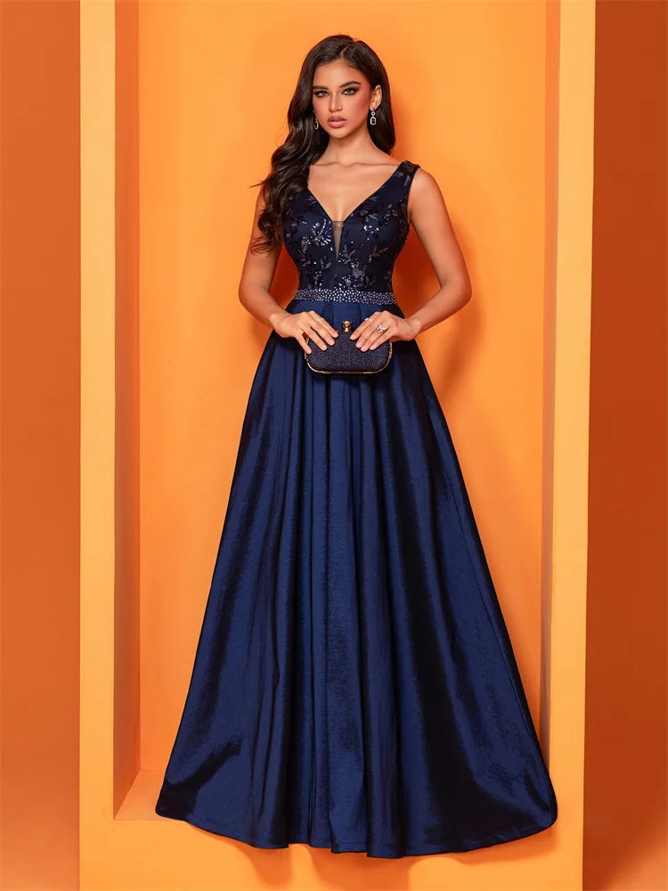 Elegant navy blue satin evening dress with sequins and a deep V-neck, perfect for formal occasions.