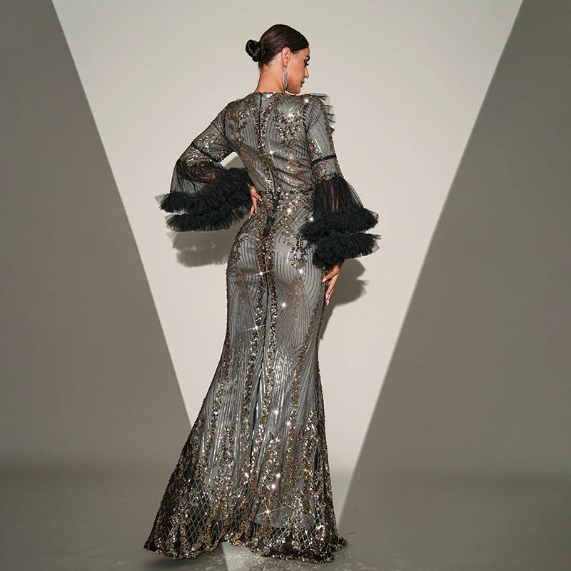 Elegant black maxi dress with sequins, flare sleeves, and a sheer mesh design for formal occasions.