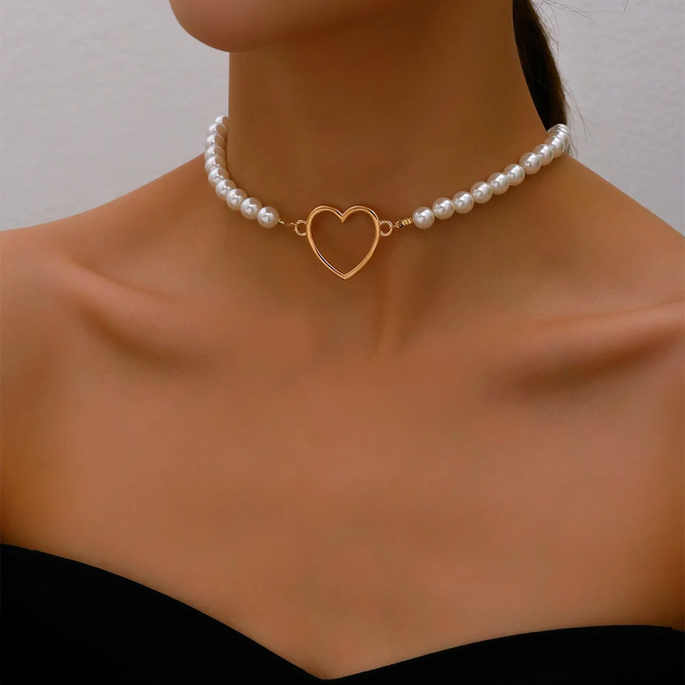 Adjustable pearl choker necklace featuring a string of elegant pearls and gold heart Pendant, offering a customizable fit for a timeless and sophisticated look.