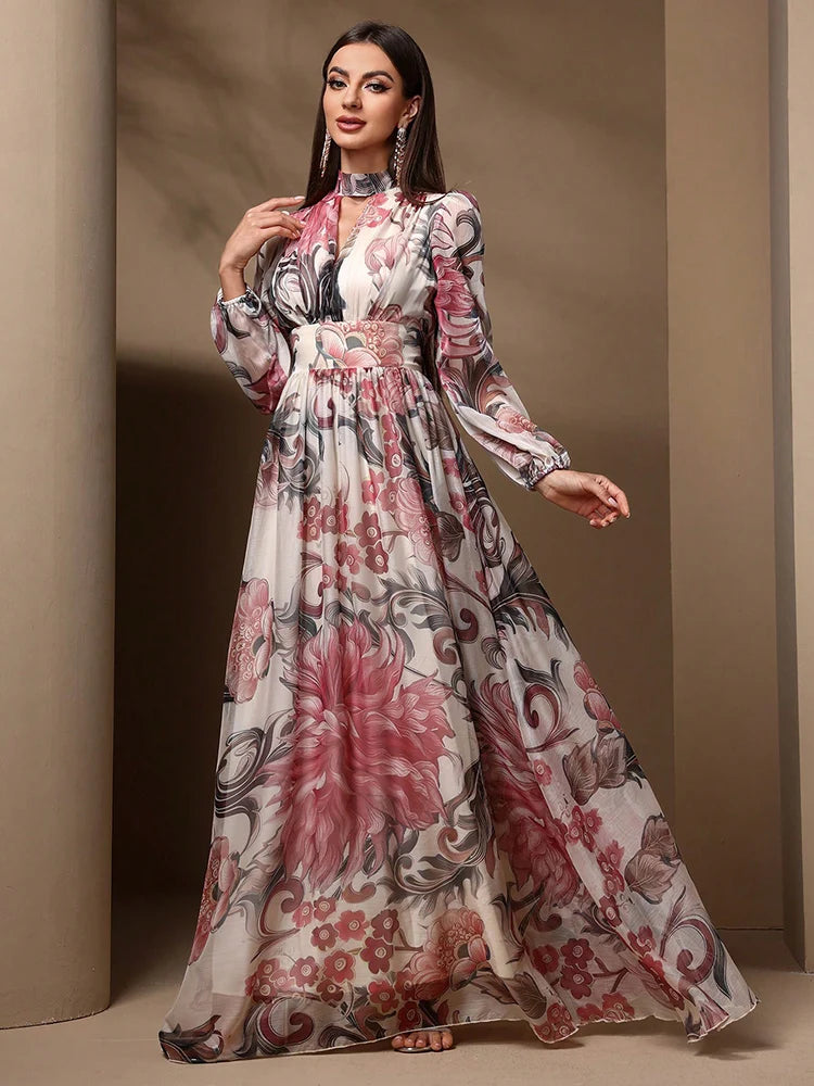 High-waist floral print maxi dress with tie-back detailing and long sleeves, ideal for formal or casual summer wear.