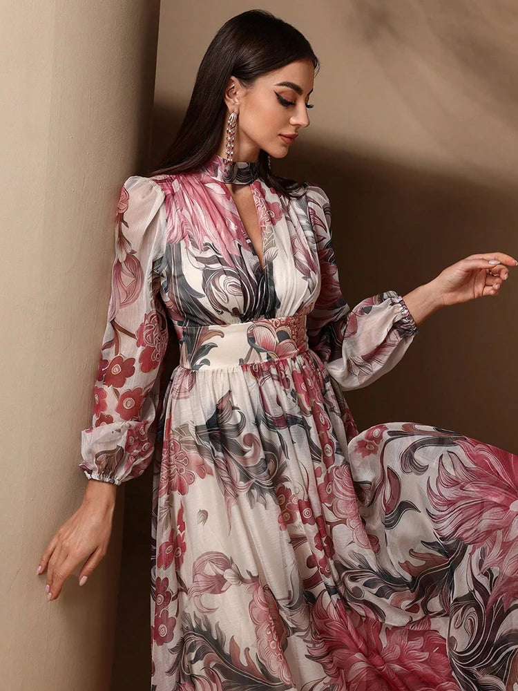 High-waist floral print maxi dress with tie-back detailing and long sleeves, ideal for formal or casual summer wear.