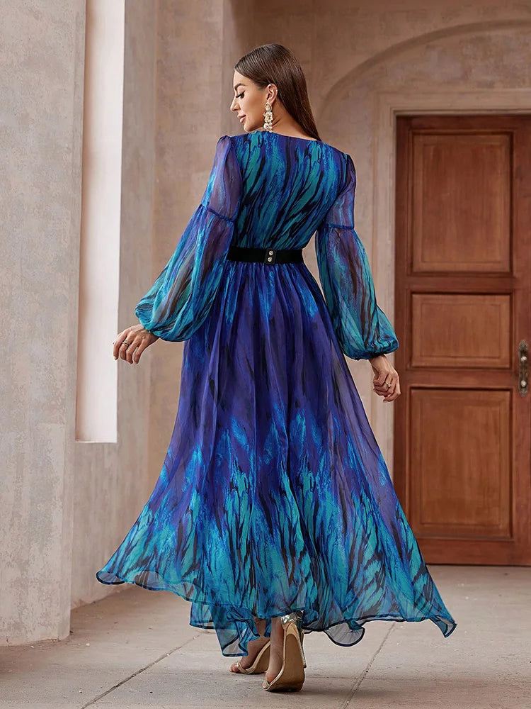 V-neck mesh maxi dress with long sleeves, belted waist, and a flowing design, perfect for formal events, available in blue.