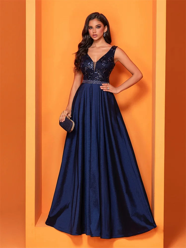 Elegant navy blue satin evening dress with sequins and a deep V-neck, perfect for formal occasions.