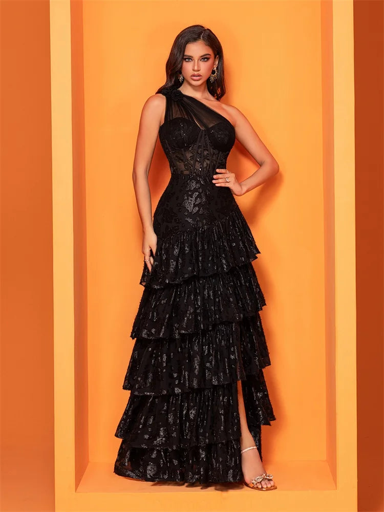 Black skew-shouldered sequin mermaid evening dress with a slit, perfect for formal events and parties.