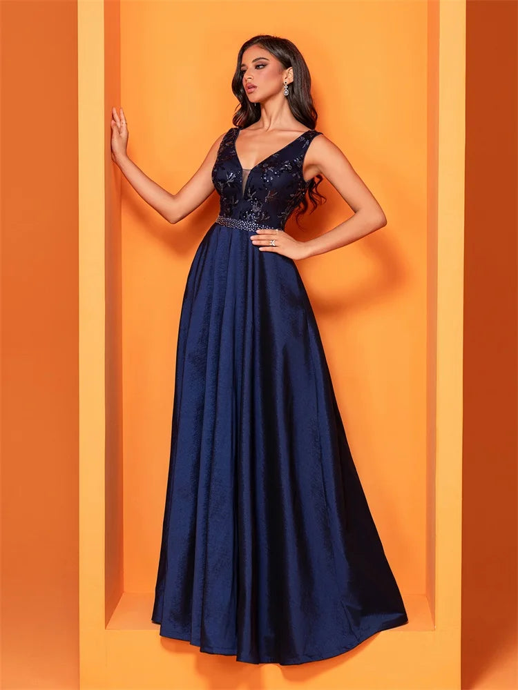 Elegant navy blue satin evening dress with sequins and a deep V-neck, perfect for formal occasions.