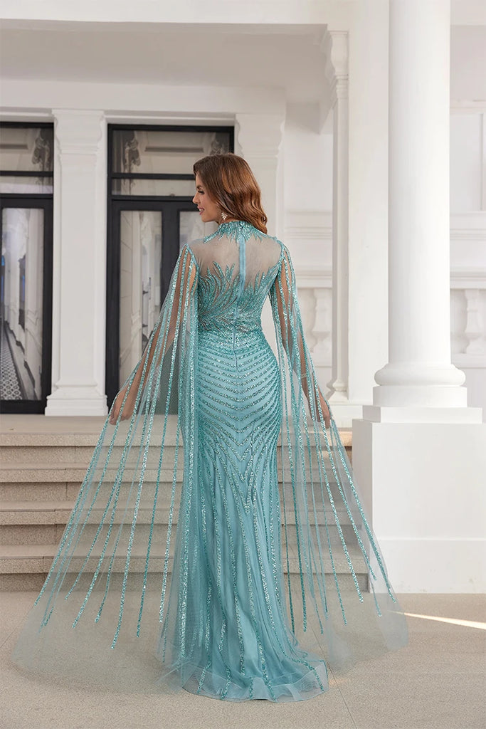 Beaded mint mermaid evening dress with a cape, perfect for prom and formal events.