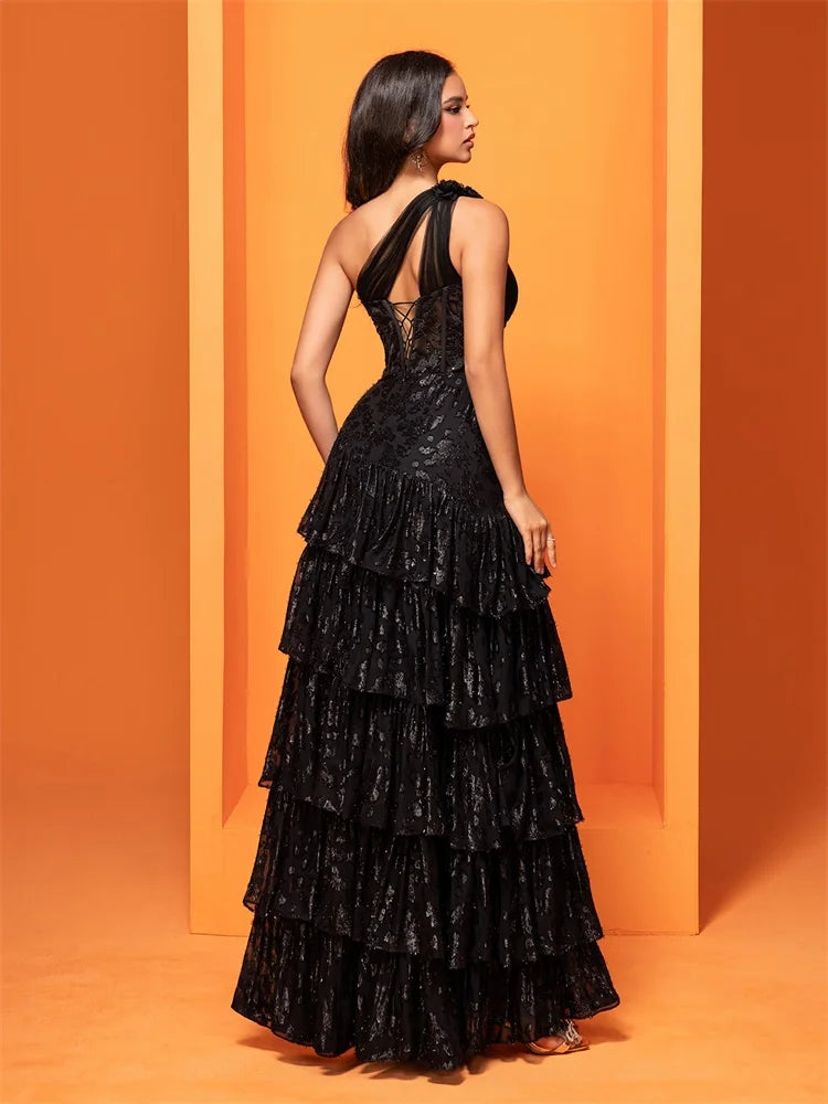 Black skew-shouldered sequin mermaid evening dress with a slit, perfect for formal events and parties.