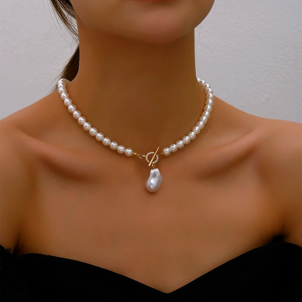 Adjustable pearl choker necklace featuring a string of elegant pearls and Crystal Pendant, offering a customizable fit for a timeless and sophisticated look.






