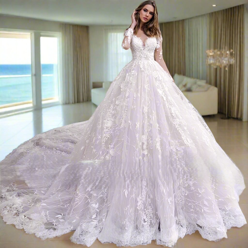 Exquisite long-sleeve bridal gown featuring intricate lace detailing and a dramatic cathedral train. The fitted bodice flows gracefully into a voluminous skirt, creating an ethereal and timeless look. Perfect for a fairy-tale wedding.