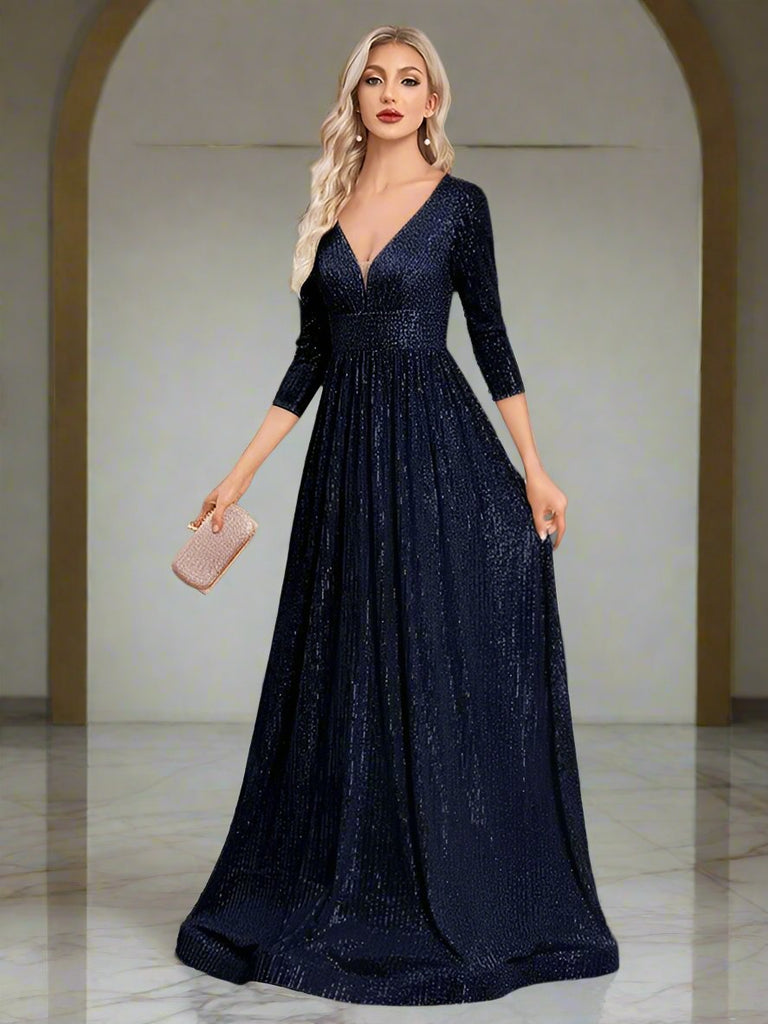 An elegant Navy blue sequin gown with a deep V-neckline, 3/4 sleeves, and a flowing A-line silhouette is perfect for evening galas or formal occasions.