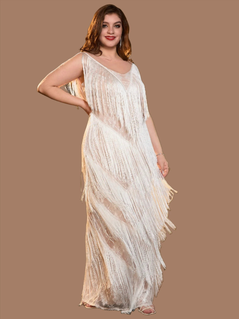 White plus size sequin mini dress with a V-neckline, fringe details, sleeveless design, and back zipper closure.