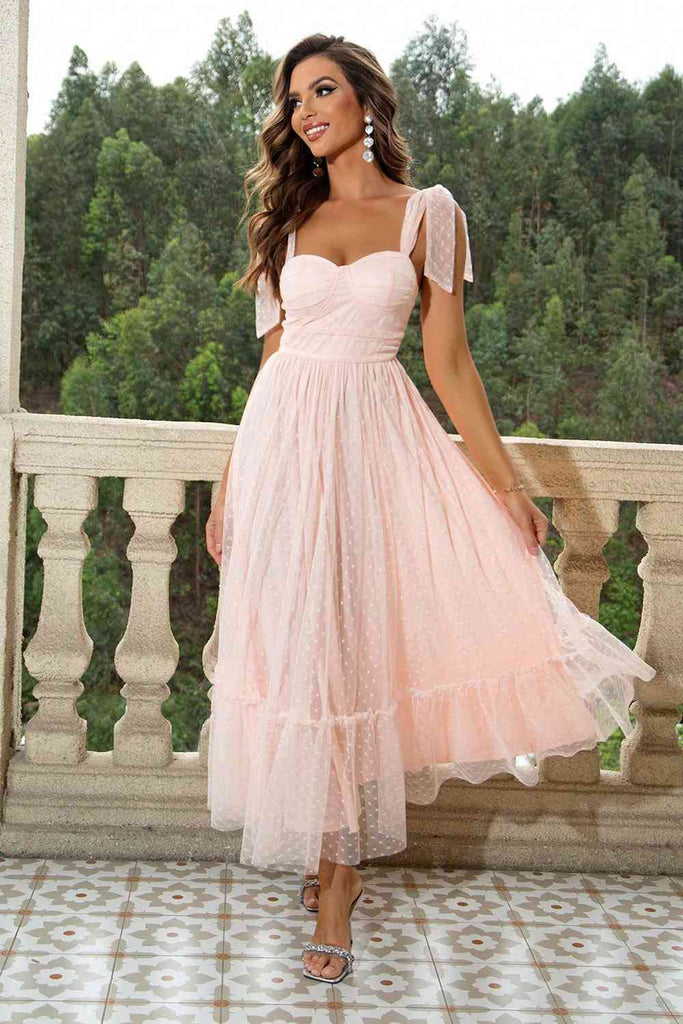 Sweetheart neckline maxi dress in blush pink, floor-length and sleeveless, ideal for formal events.